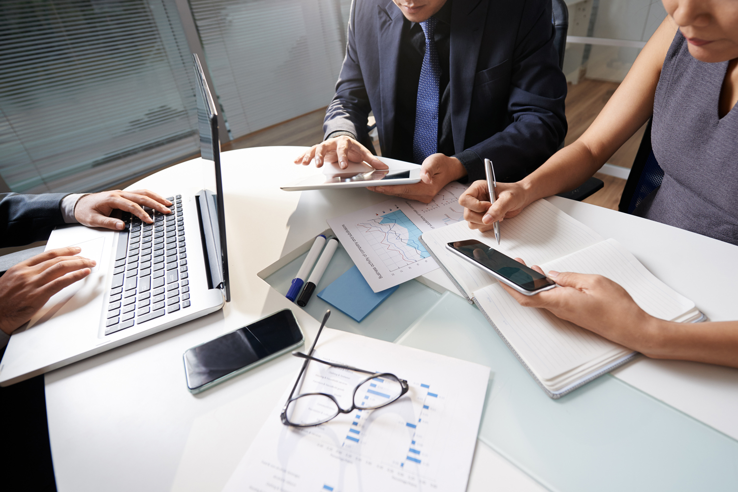 business-people-sitting-office-desk-working-project-1